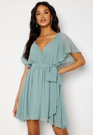 Se Goddiva Flutter Skater Dress Dark green XL (UK16) ved Bubbleroom