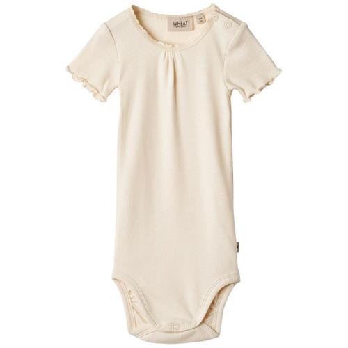 Se Wheat Edna Babybody Cremefarvet |  | 86 cm ved Babyshop