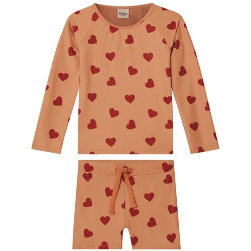 Se Kuling Rhodes Hjertemønstret UV-sæt Terracotta | Orange | 110/116 cm ved Babyshop