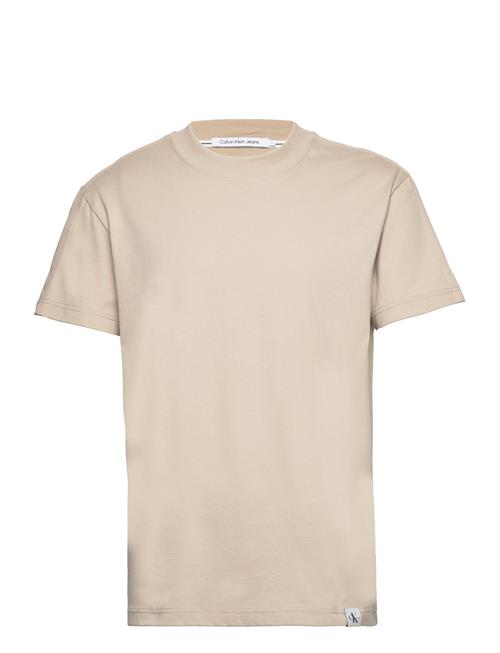 Se Calvin Klein Jeans Woven Tab Tee Calvin Klein Jeans Cream ved Booztlet