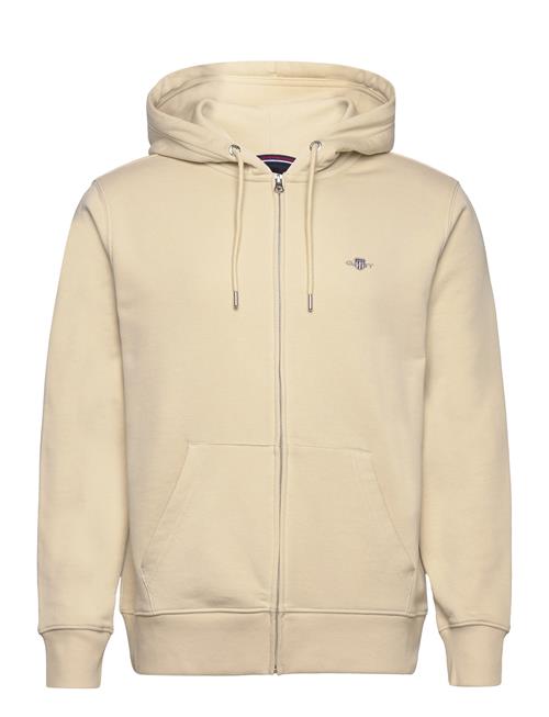 Se GANT Reg Shield Full Zip Hoodie GANT Beige ved Booztlet