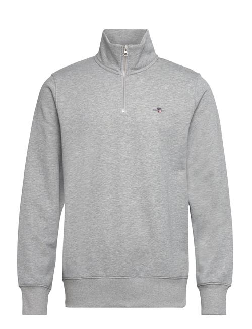 Se GANT Reg Shield Half Zip Sweat GANT Grey ved Booztlet