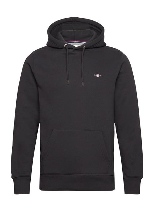 Se GANT Reg Shield Hoodie GANT Black ved Booztlet