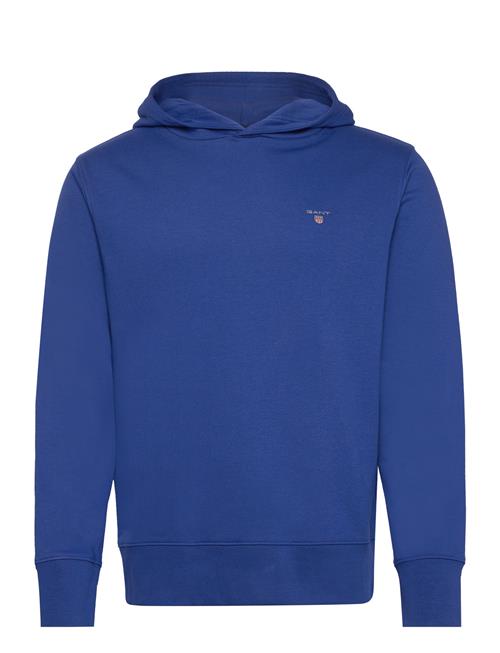 Se GANT Reg Emb Original Shield Hood GANT Blue ved Booztlet