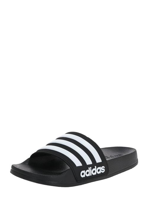 Se ADIDAS SPORTSWEAR Strand-/badesko 'Adilette Shower'  sort / hvid ved About You