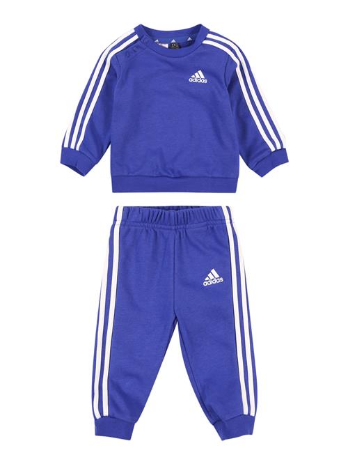 Se ADIDAS SPORTSWEAR Træningsdragt 'Essentials'  blå / hvid ved About You