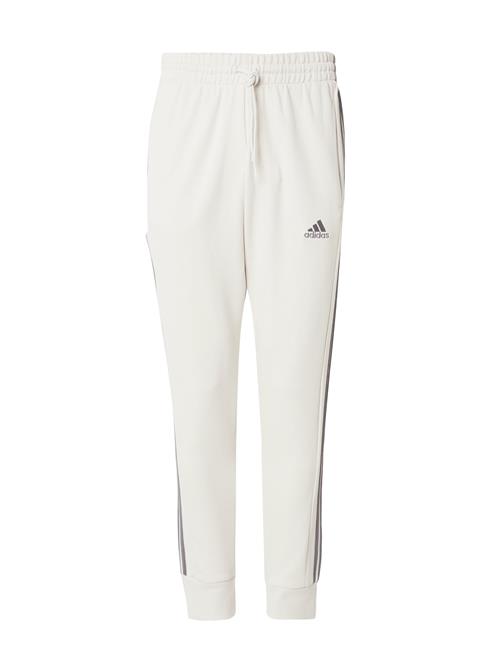 Se ADIDAS SPORTSWEAR Sportsbukser 'Essentials'  beige / grå ved About You