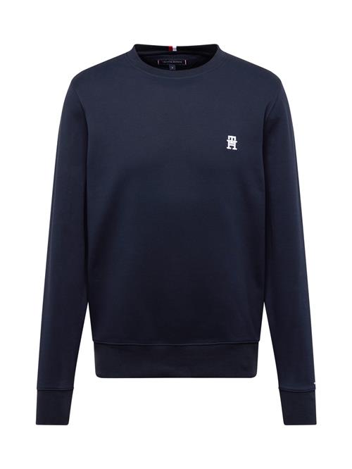 Se TOMMY HILFIGER Sweatshirt  mørkeblå / hvid ved About You