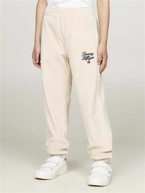 Se Tommy Hilfiger TH Script Velour Pant Str 10 Velour - Heathered Oat Bukser hos Magasin ved Magasin