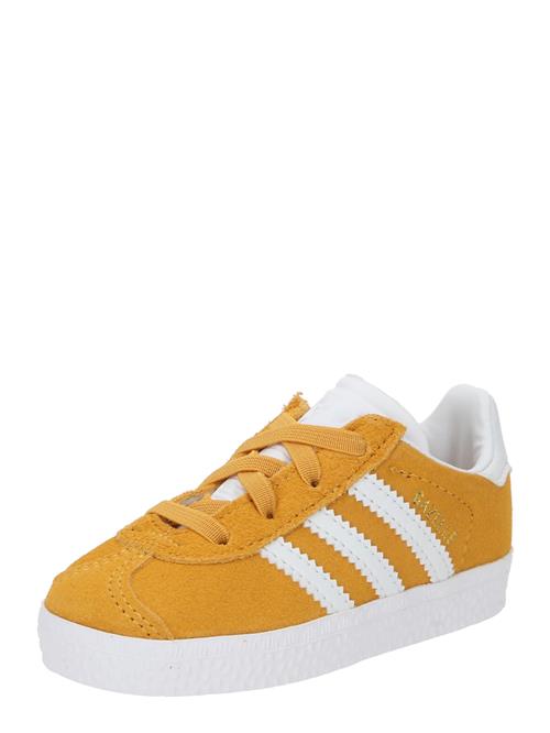 Se ADIDAS ORIGINALS Sneakers 'GAZELLE'  curry / hvid ved About You