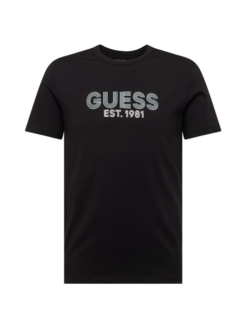 Se GUESS Bluser & t-shirts 'CLASSIC'  sort / hvid ved About You