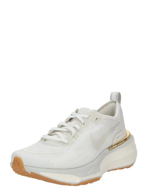 Se NIKE Løbesko 'Invincible 3'  beige / ecru / guld ved About You