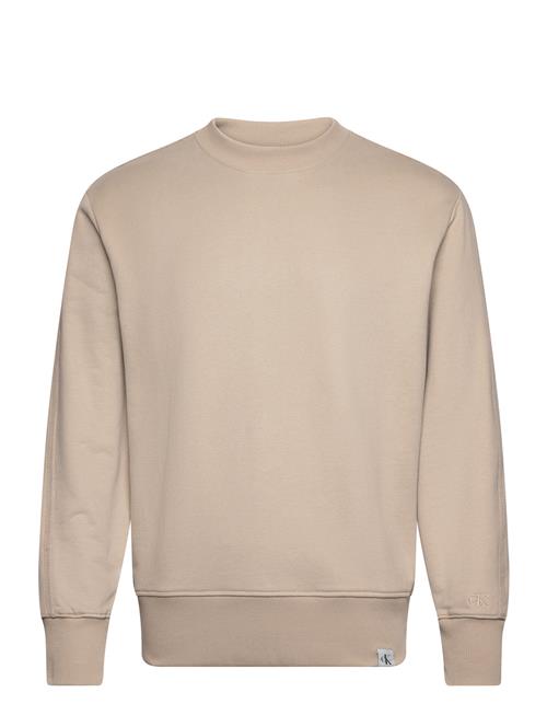 Se Calvin Klein Jeans Woven Tab Crew Neck Calvin Klein Jeans Beige ved Booztlet