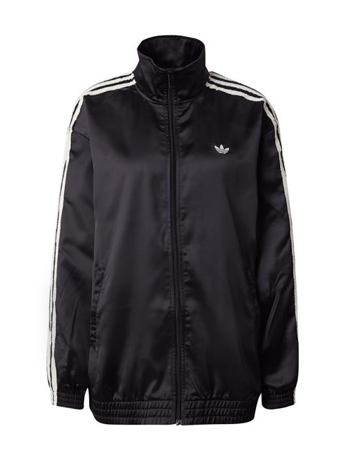 Se ADIDAS ORIGINALS Overgangsjakke 'Firebird'  sort / hvid ved About You