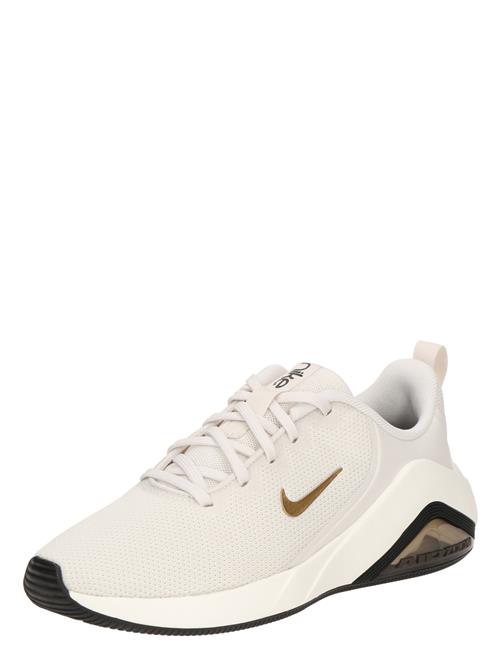 NIKE Sportssko 'Bella 7'  beige / guld / sort