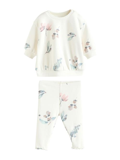 Next Joggingdragt  creme / lyseblå / lyserød / sort