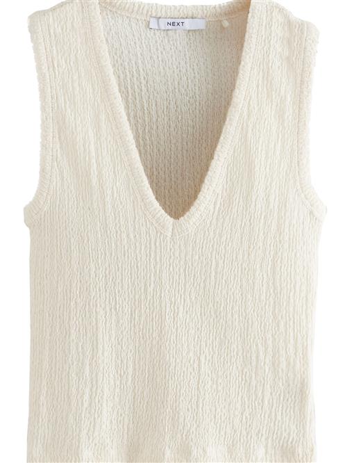 Next Overdel  lysebeige