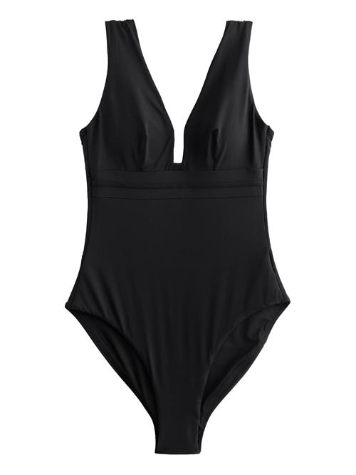 Next Formgivende badedragt  sort